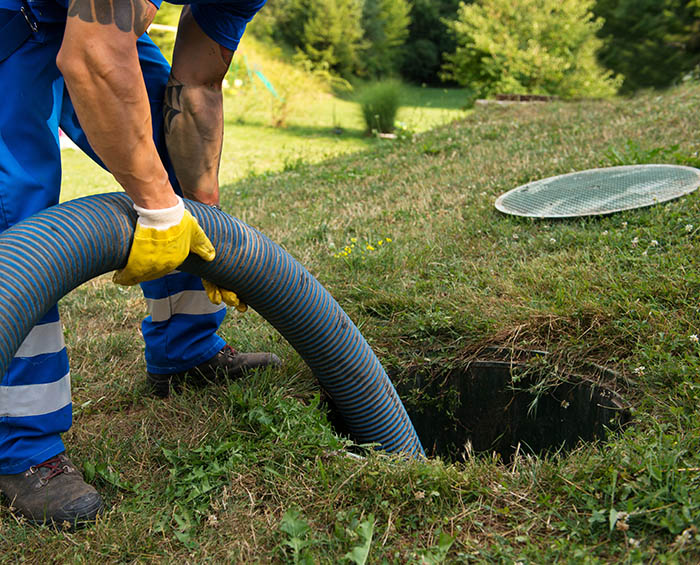 Emptying household septic tank. Cleaning sludge from septic system.